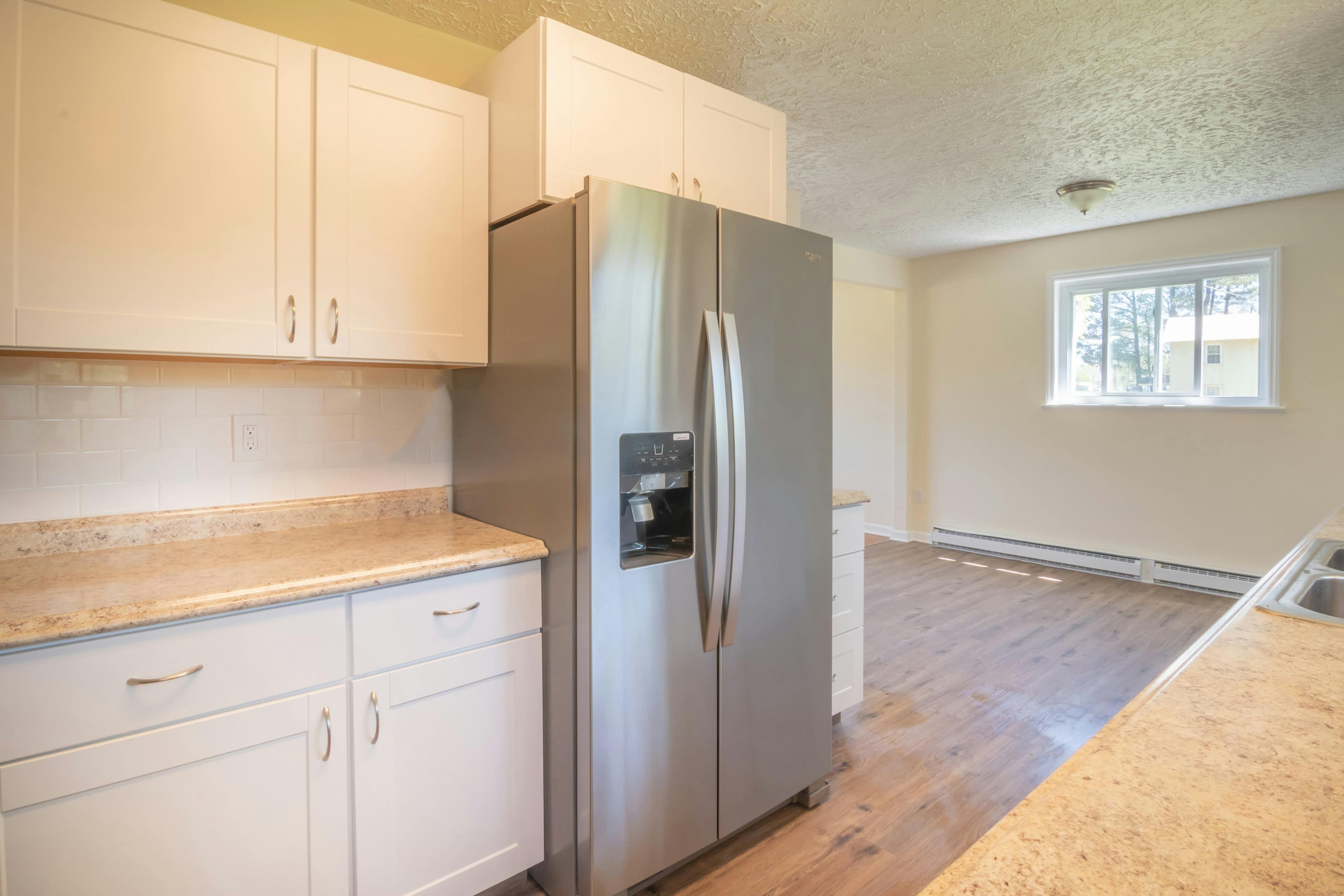 Bright renovated kitchen with white shaker cabinets in Ellicott City