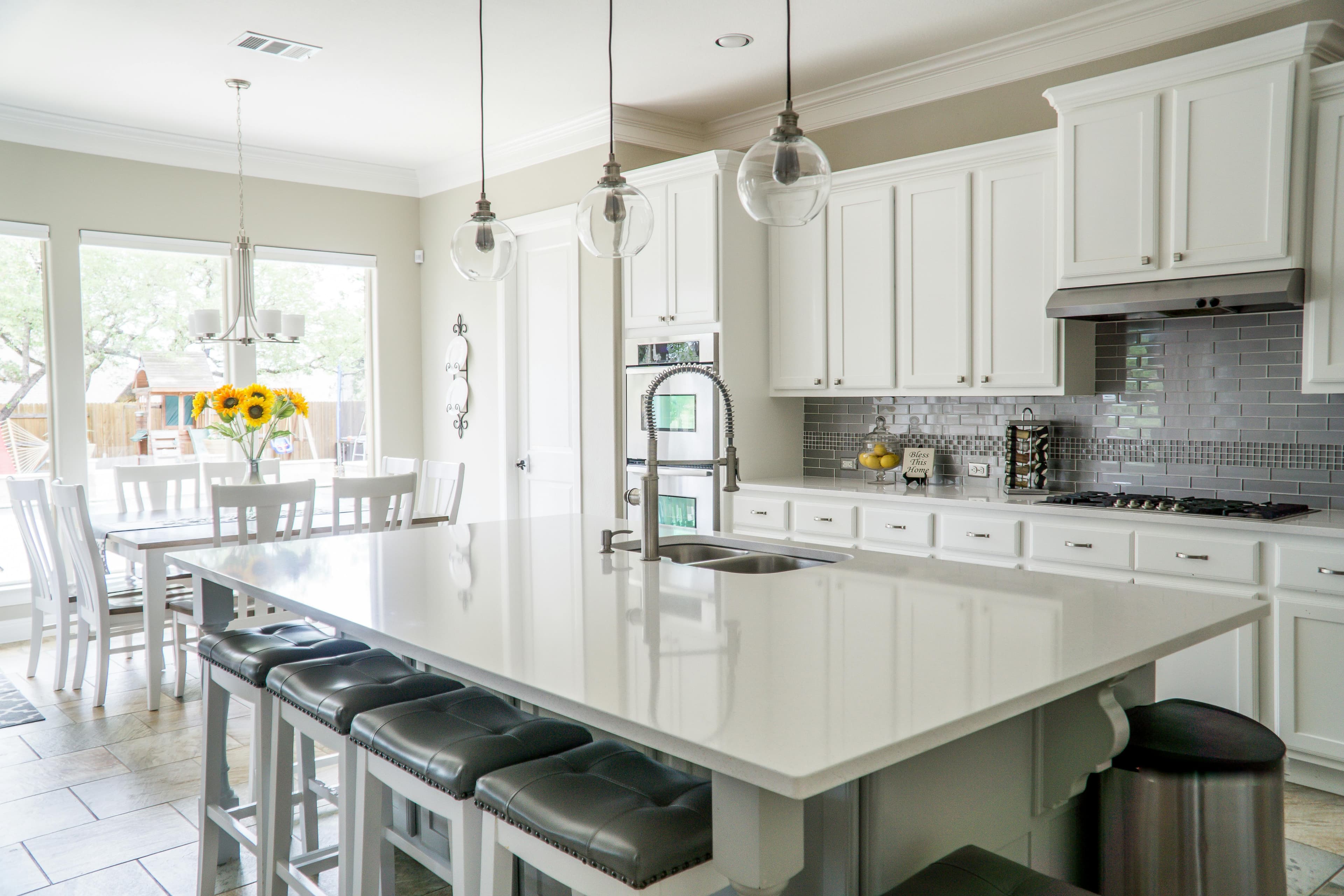 White kitchen with island and pendant lighting in Baltimore area