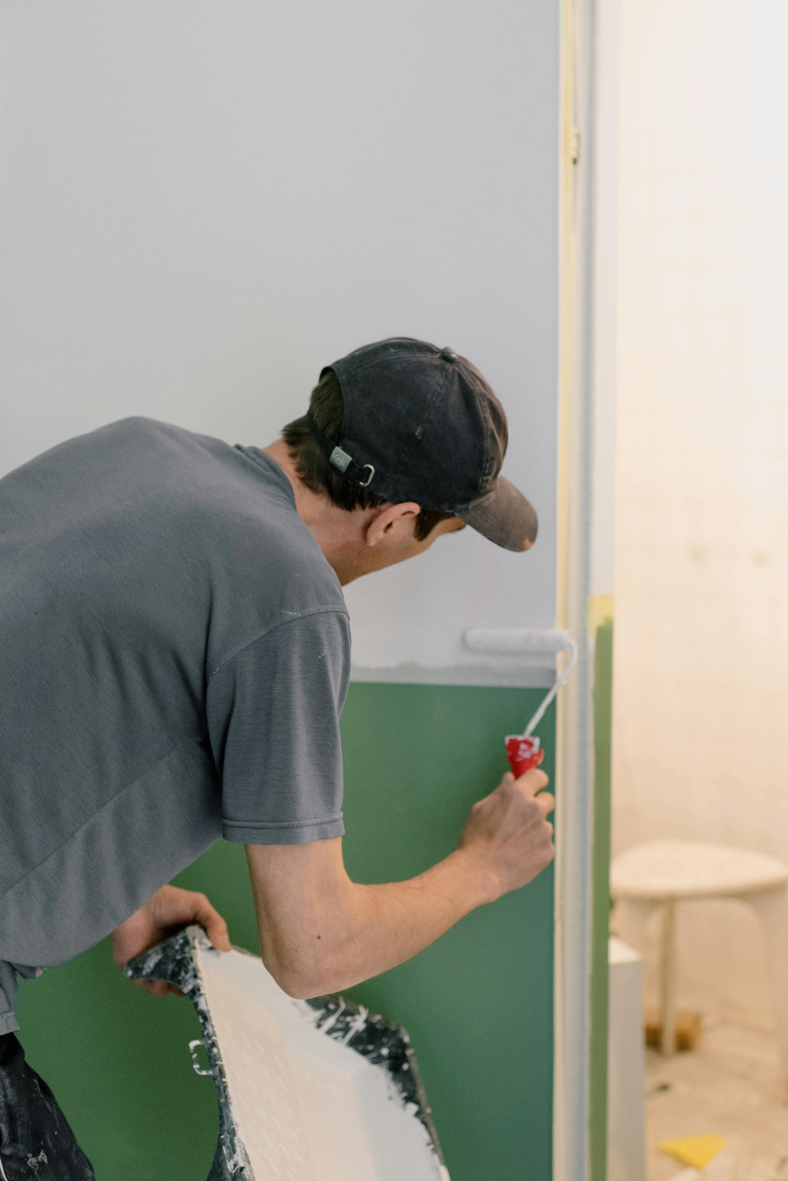 Painter rolling walls in Baltimore area home
