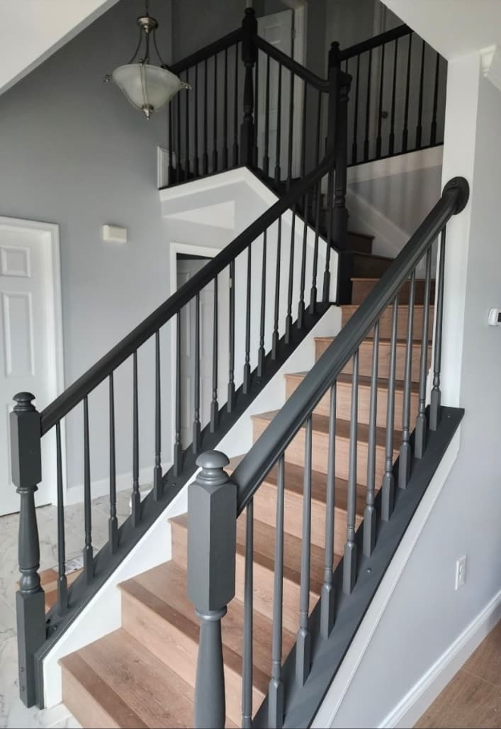 Staircase railing painting and refinishing by Elite Finishes