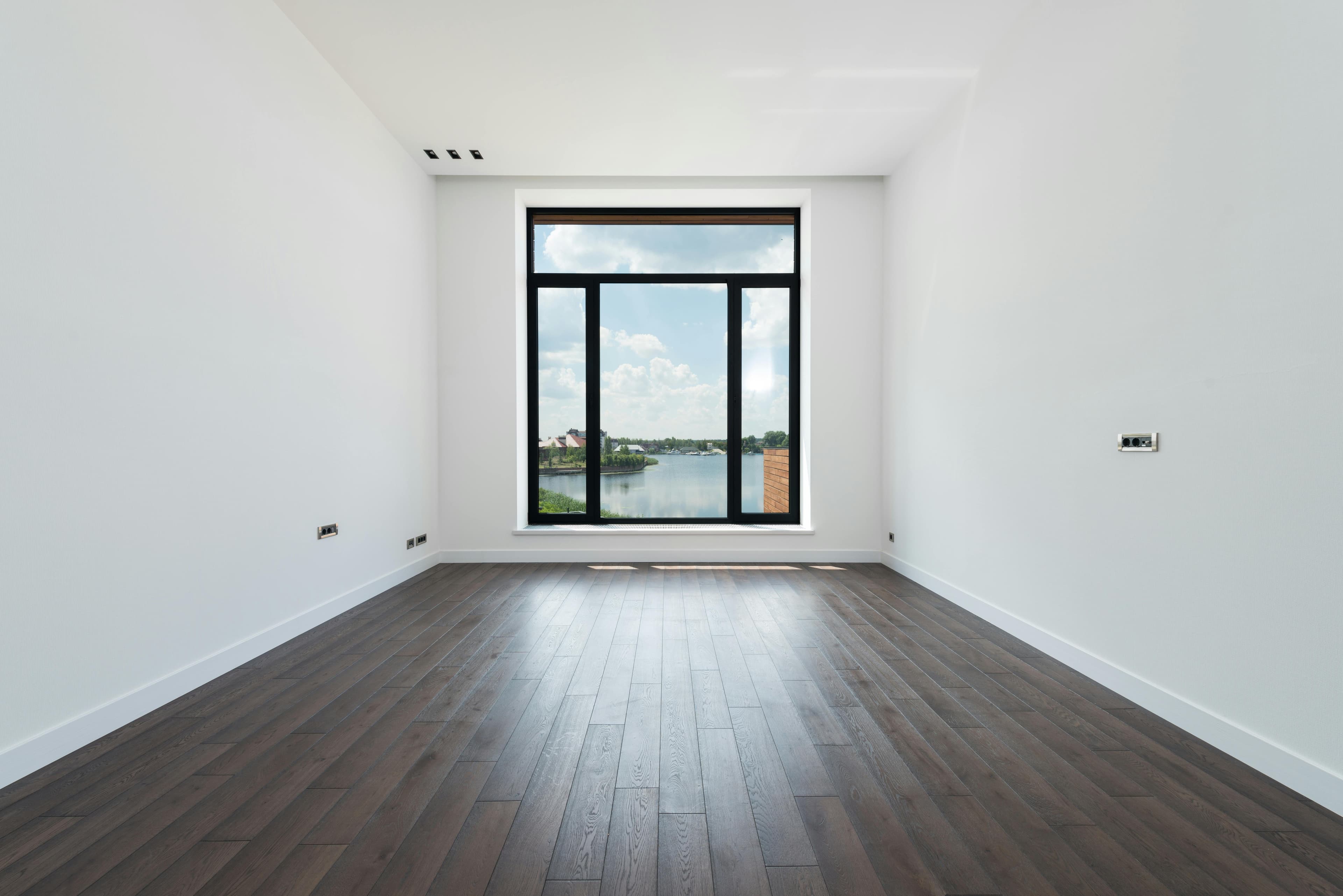 Elite Finishes painter working on an interior room