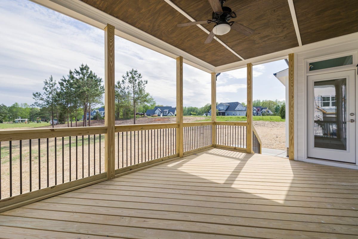 Newly built screened deck with composite decking and railings on a Maryland home