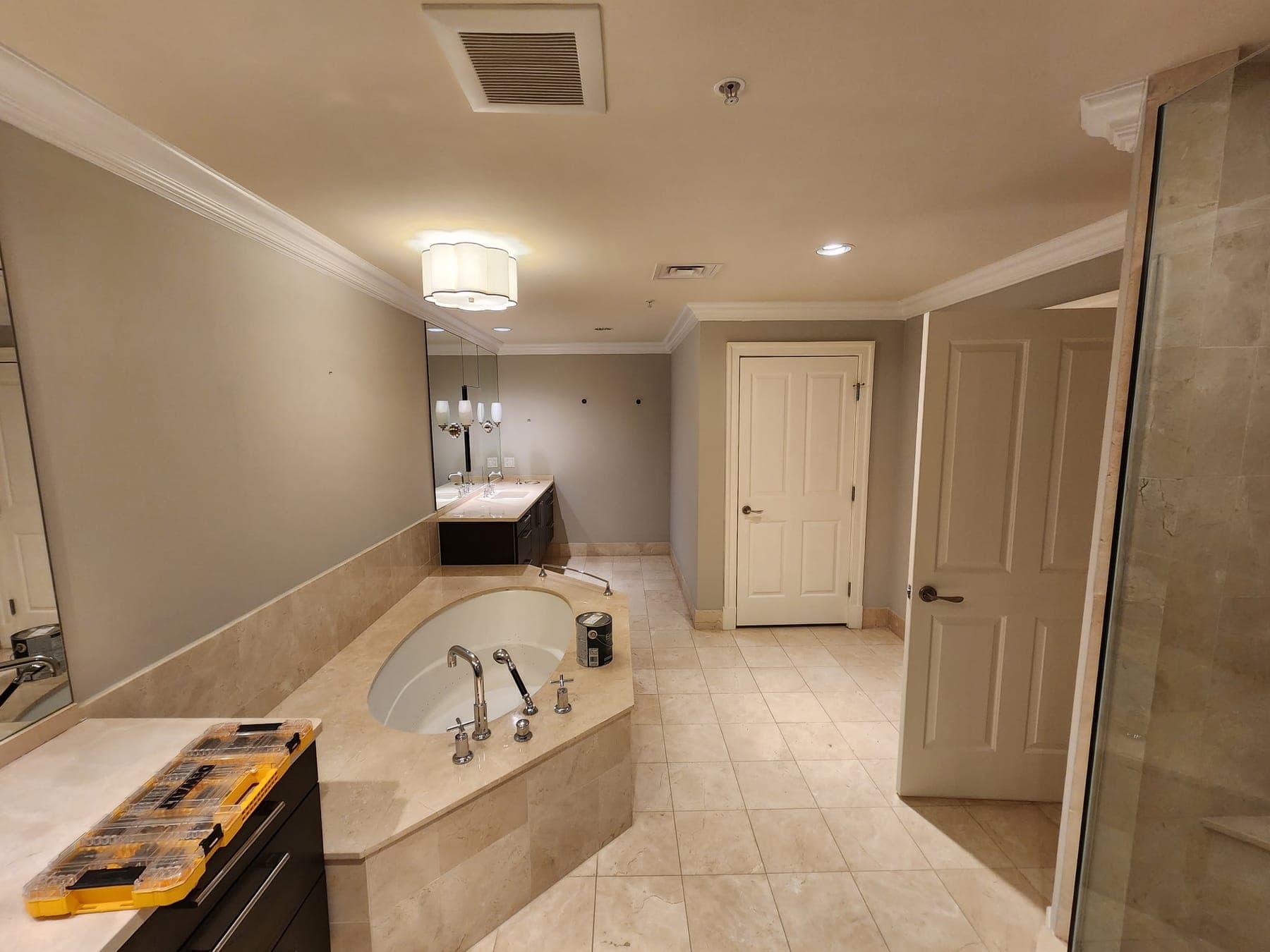 Primary bathroom remodel with gray tile and soaking tub by Elite Finishes in Baltimore